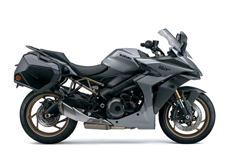 Load image into Gallery viewer, A silver and black 2025 Suzuki GSX-S 1000 TRQ motorcycle with side panniers, shown from a side profile on a white studio background.
