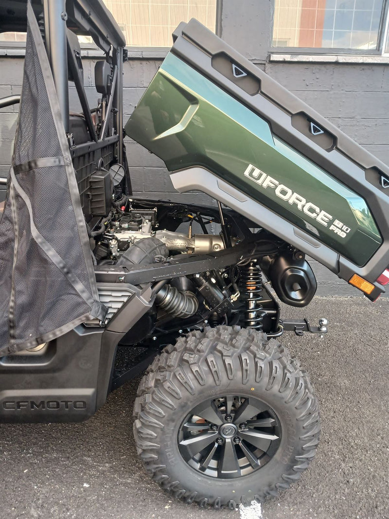Load image into Gallery viewer, Close-up of a vehicle with a lowed Tray and off-road tire on a street.