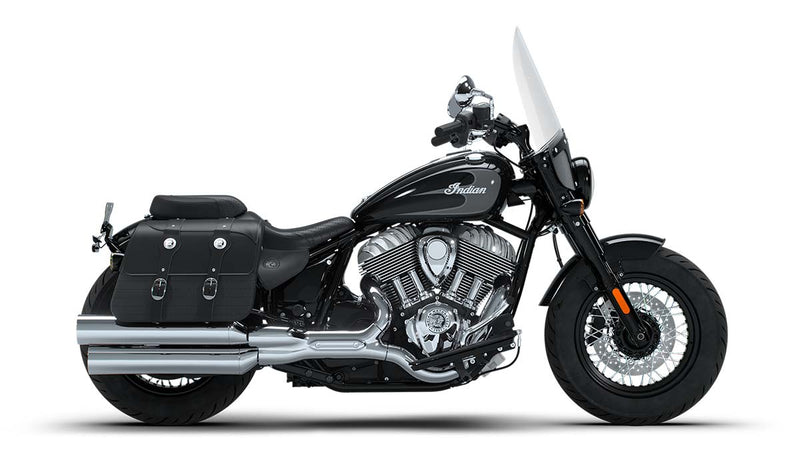 Load image into Gallery viewer, A black Indian Super Chief cruiser motorcycle with chrome engine components, black saddlebags, and a clear windshield, shown in a side profile on a white background.