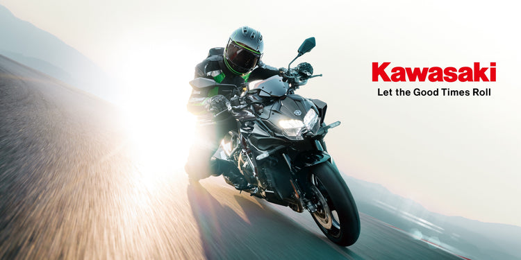Motorcyclist riding a Kawasaki Ninja H2 motorcycle on a blurred road background