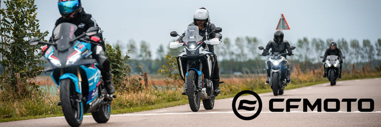 New Yamaha XSR900 GP sport motorcycle available at Cyclespot New Zealand, shown riding through an urban landscape with retro red and white styling.
