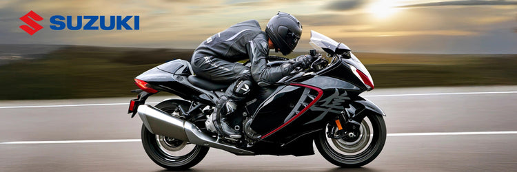 New Yamaha XSR900 GP sport motorcycle available at Cyclespot New Zealand, shown riding through an urban landscape with retro red and white styling.