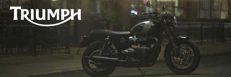 New Yamaha XSR900 GP sport motorcycle available at Cyclespot New Zealand, shown riding through an urban landscape with retro red and white styling.