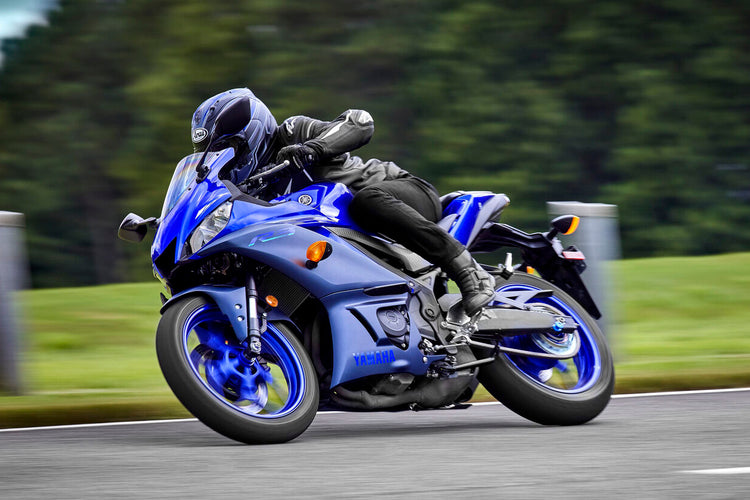 A clean, blue and black Yamaha YZF-R3 superstock motorcycle positioned for a DIY service and maintenance guide.