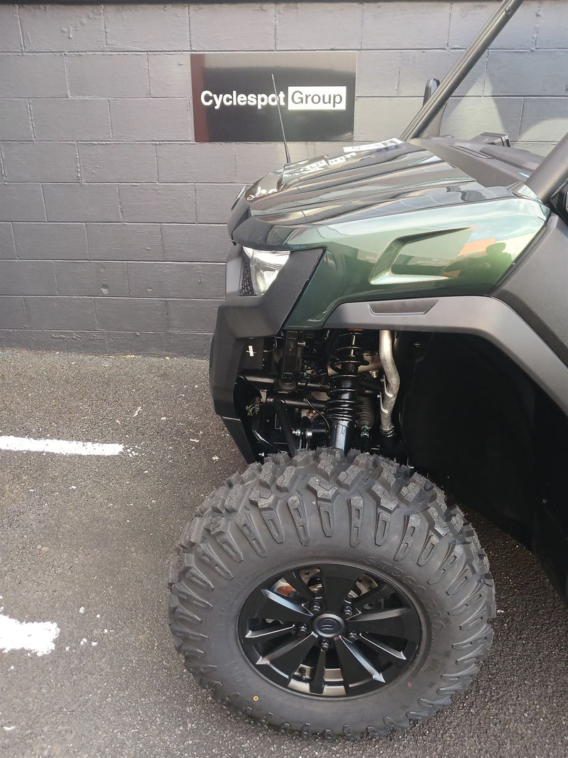 Load image into Gallery viewer, Close-up of a vehicle's wheel and suspension system
