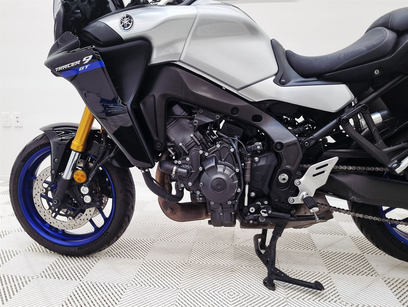 Load image into Gallery viewer, Close-up of a 2021 Yamaha Tracer 9 GT motorcycle on a checkered floor
