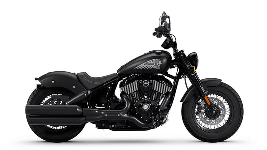 A black Indian Chief Bobber Dark Horse cruiser motorcycle with chrome engine components, a high handlebar, and a low-slung seat, shown in a side profile on a white background.