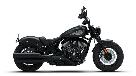 A black cruiser motorcycle with chrome accents, shown in a side profile on a clean white background.