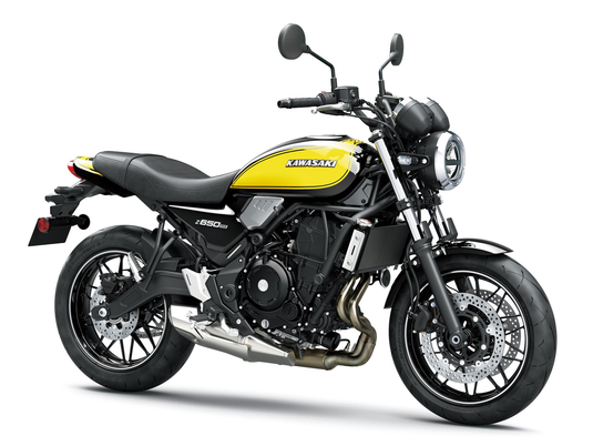 A Kawasaki Z650RS motorcycle in black and yellow, photographed from a three-quarters front angle against a clean white studio background.