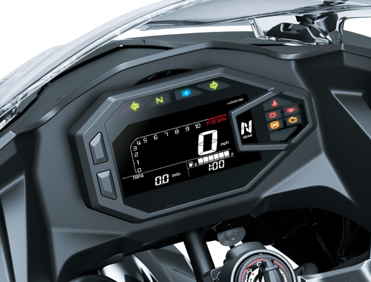 Close-up of a Kawasaki Ninja 500 motorcycle dashboard with digital display and controls.