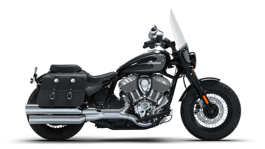 A black Indian Super Chief cruiser motorcycle with chrome engine components, black saddlebags, and a clear windshield, shown in a side profile on a white background.
